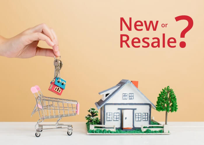 An image showing new versus resale home choice with house model, keys, and shopping cart